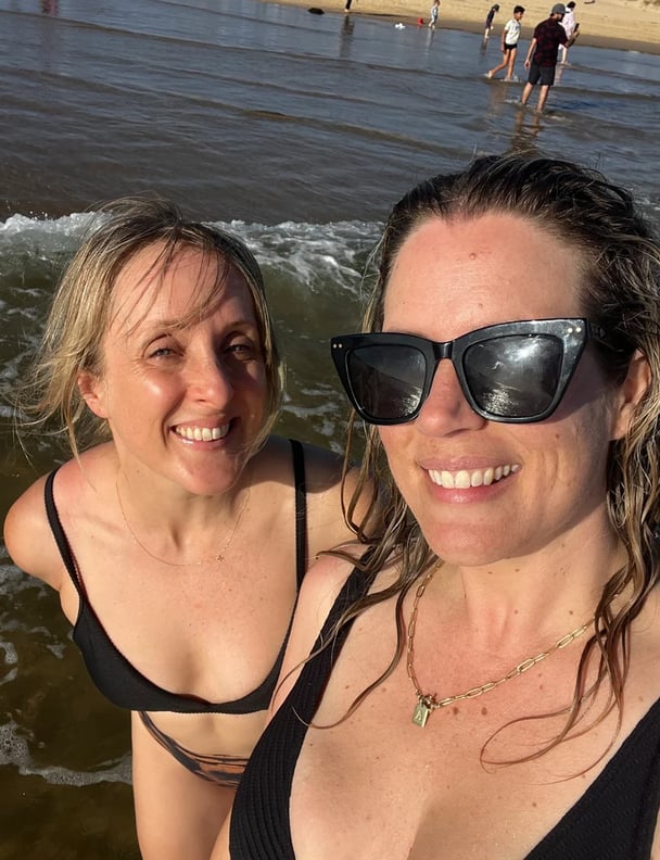photo of two women on the beach