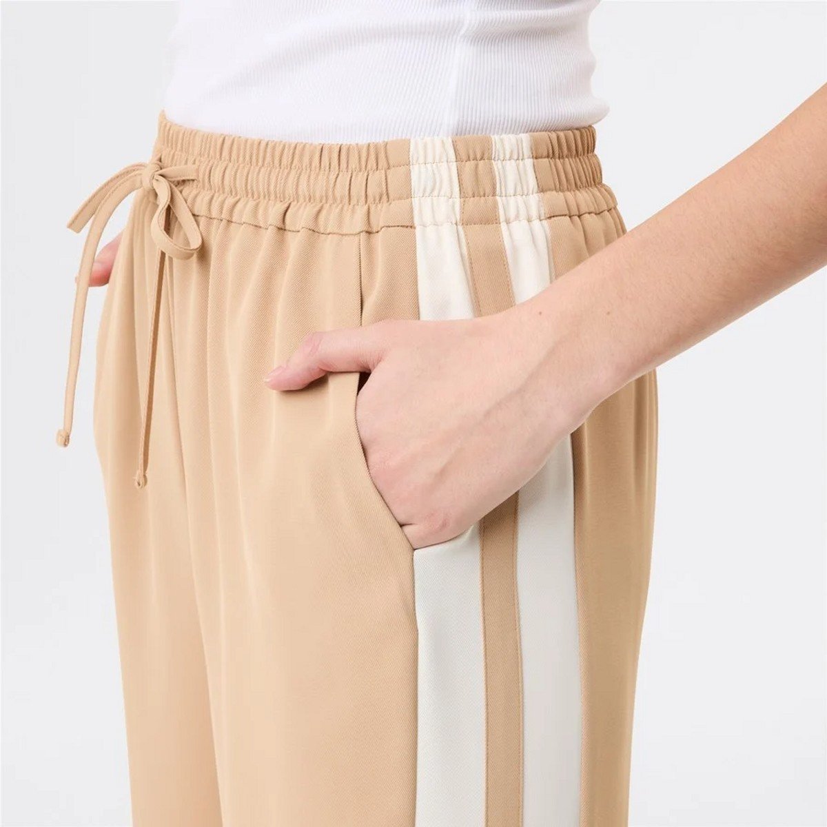 woman wearing neutral Big W pants 