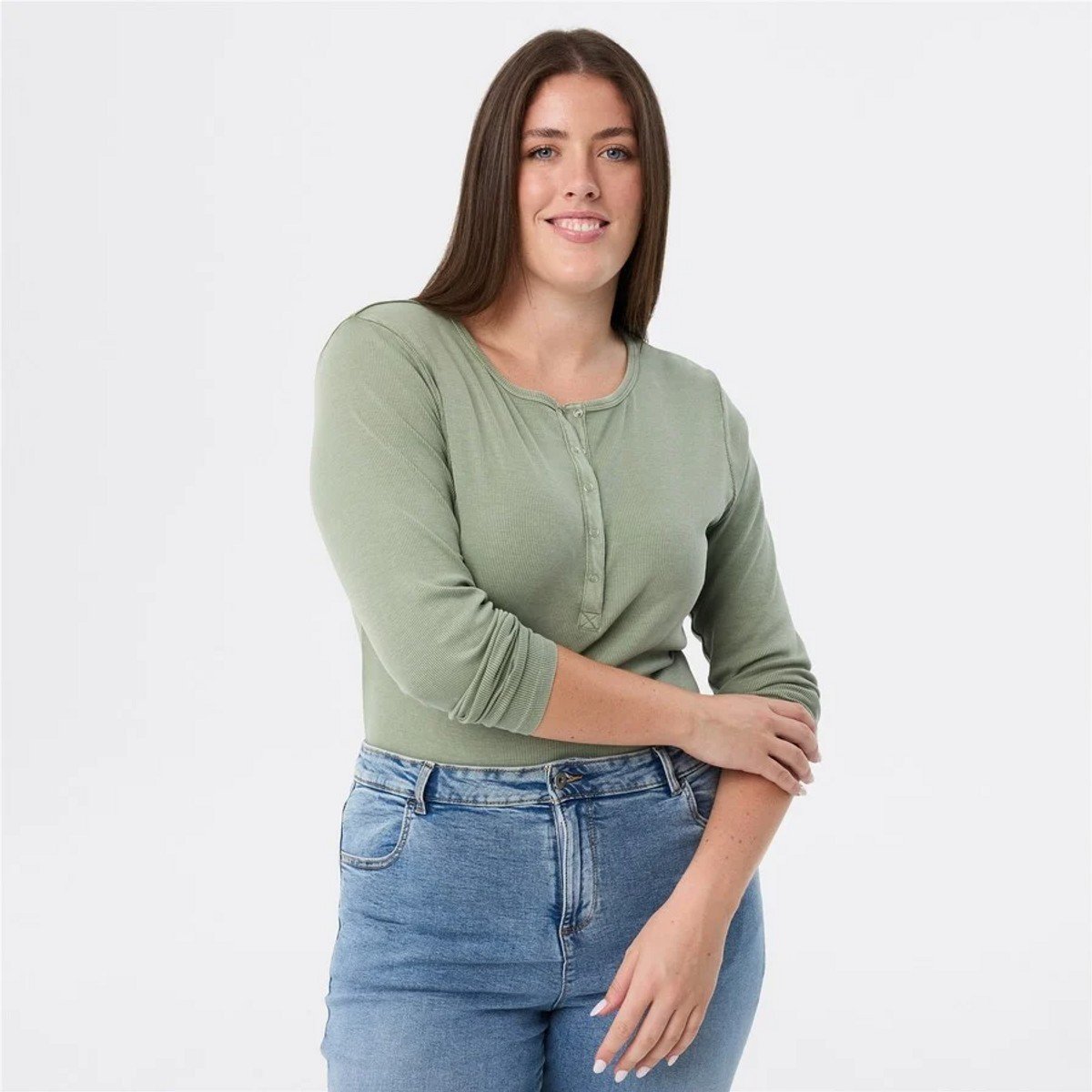 woman wearing sage green long tee