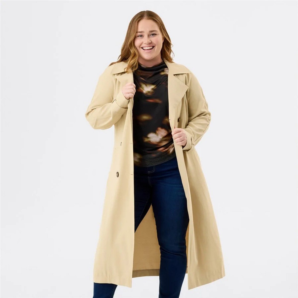 woman wearing a beige trench coat 