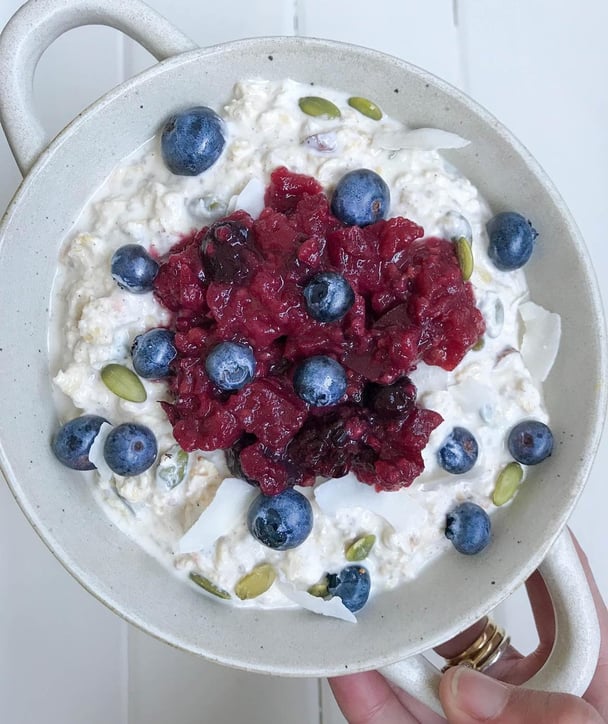 Bircher muesli topped with pepita seeds and blueberries.