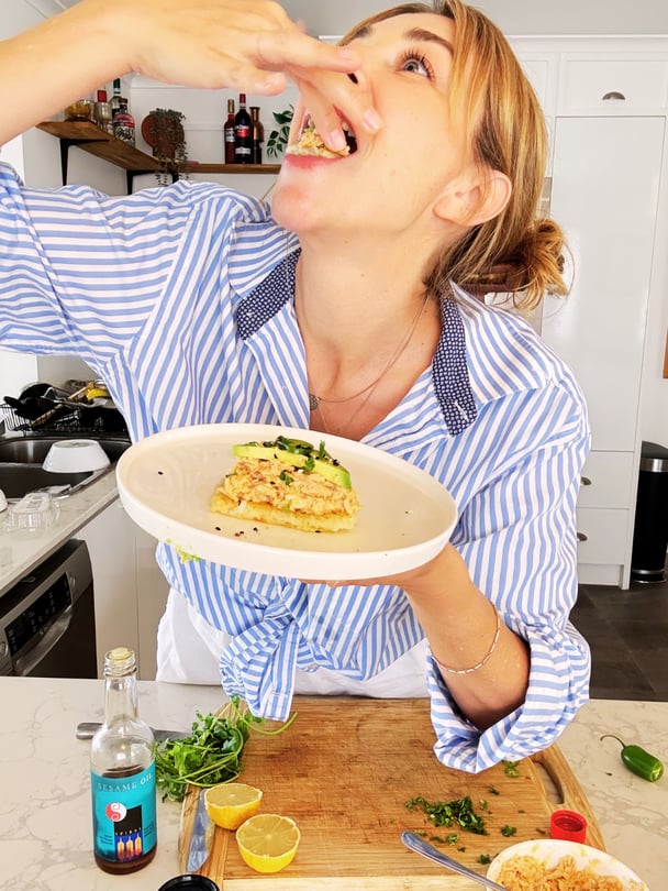 Kate enjoying a mouthful of crispy tuna rice with silky avocado.