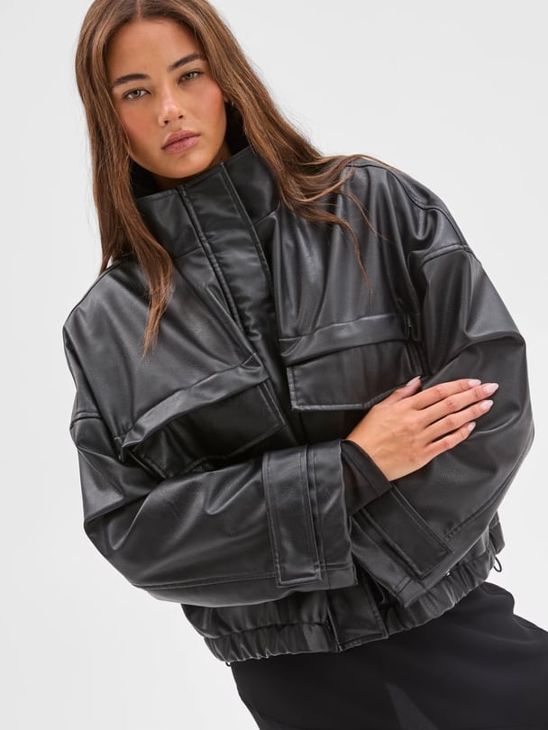 woman wearing target bomber leather jacket.
