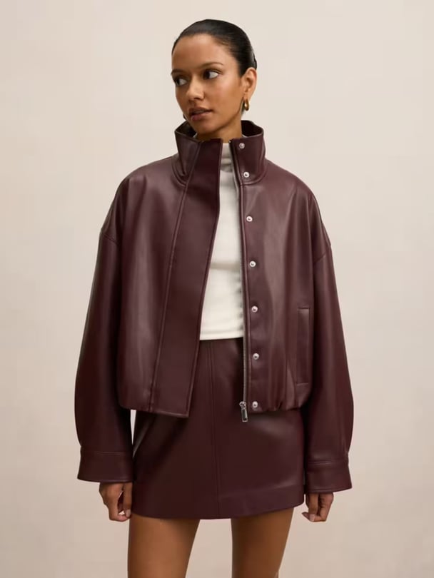 woman wearing forever new bomber leather jacket.
