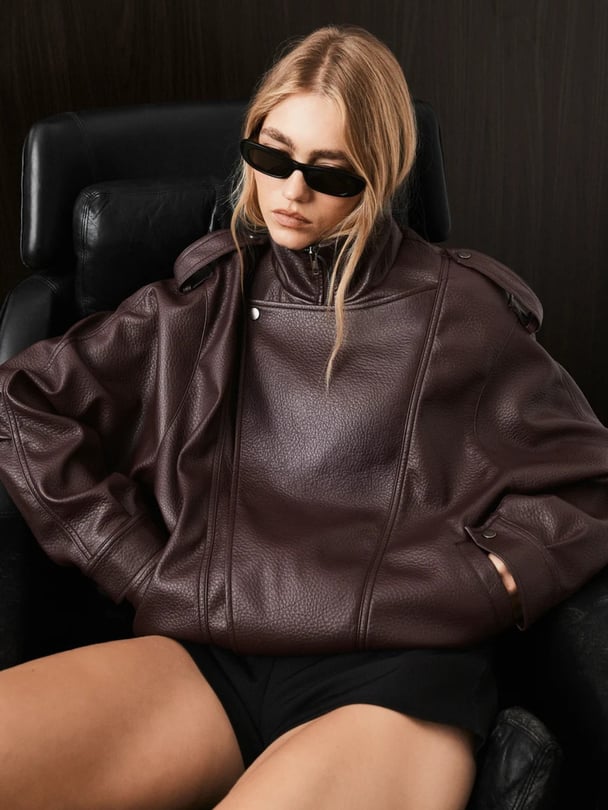 woman wearing nakedvice berry bomber leather jacket.