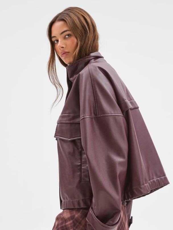woman wearing target bomber leather jacket.