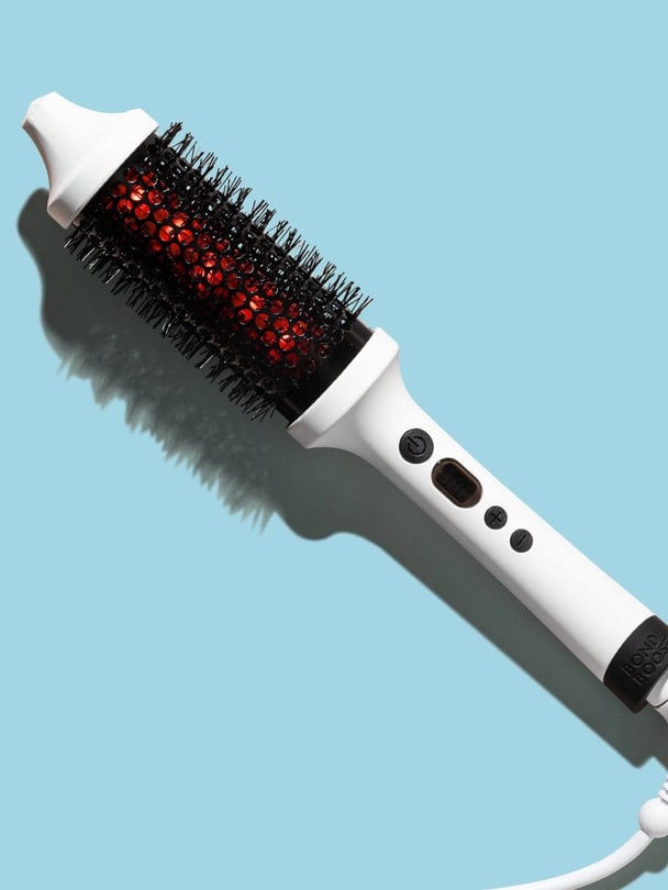 The Bondi Boost Infrared Bounce Brush on a blue backdrop.