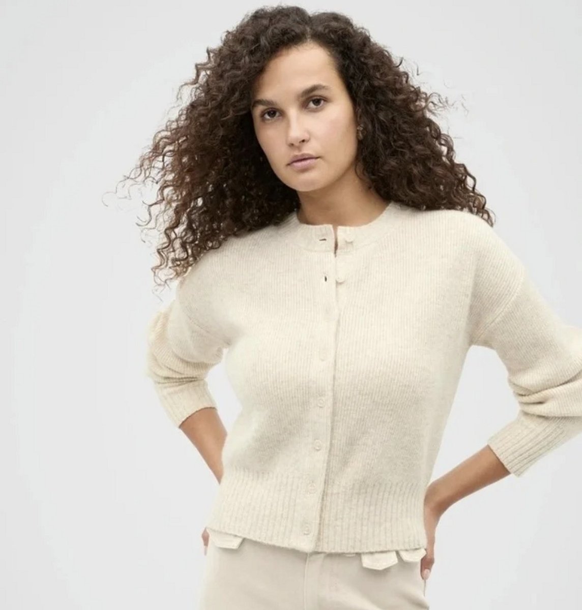 woman wearing cream cardigan 