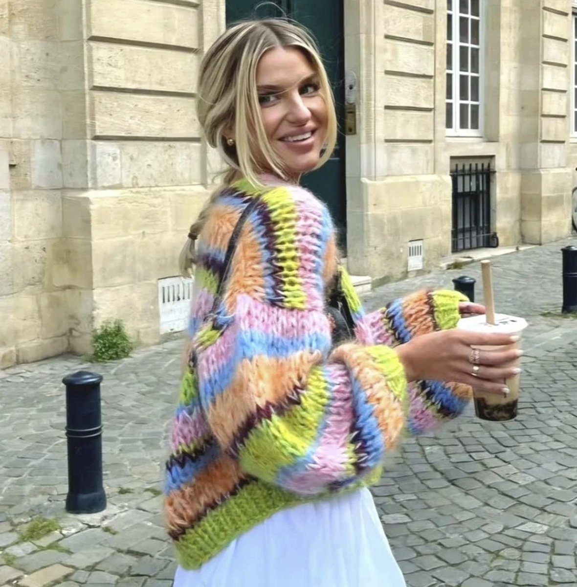 woman wearing multi coloured cardigan 