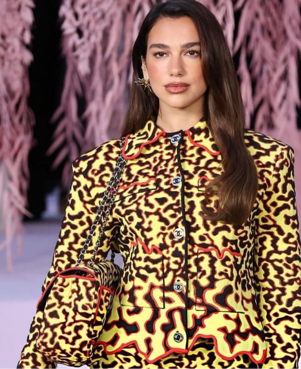 Dua Lipa wears Chanel.