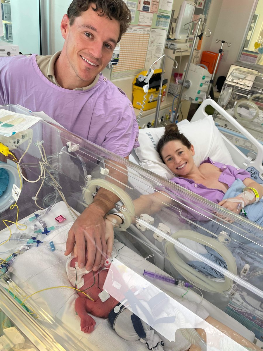 Sam and Charlotte with baby Koa in hospital.