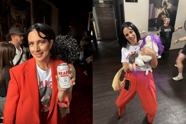 Woman at a christmas party drinking a heaps normal and dancing