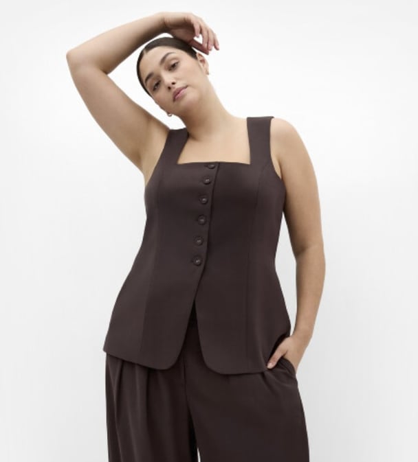 Woman wearing vest from City Chic