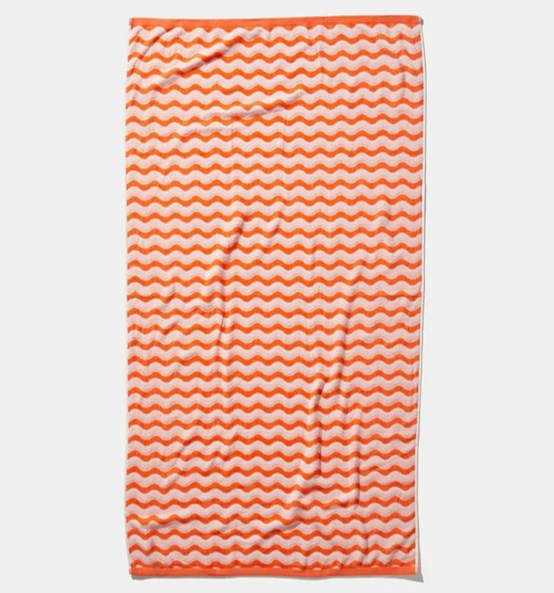 Cotton Beach Towel in an orange print 