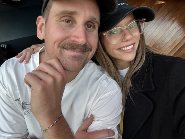 Dakota and her partner Alex smiling.