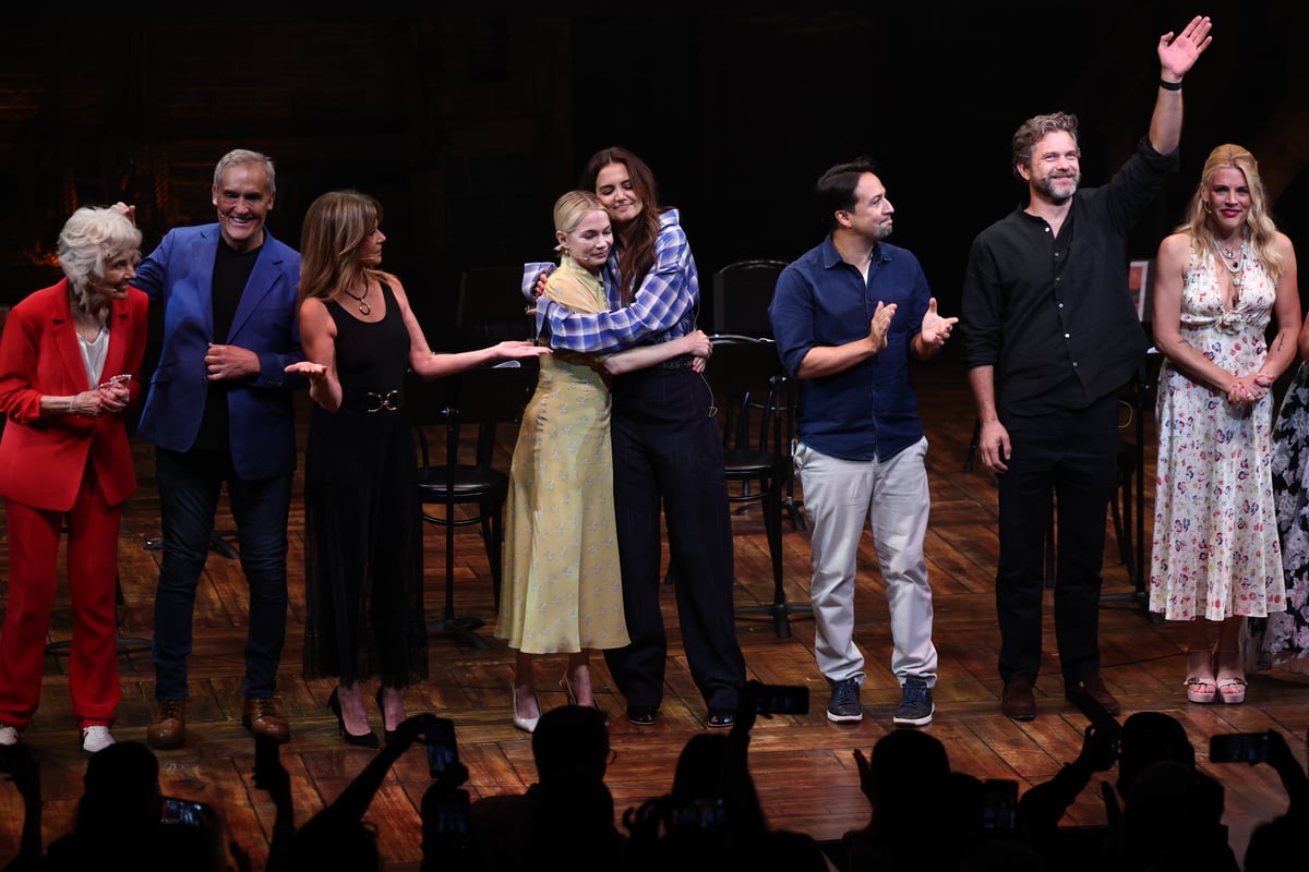 Michelle Williams and Katie Holmes embrace along cast members during the Dawson's Creek Class Reunion.