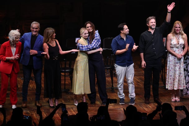 Michelle Williams and Katie Holmes embrace along cast members during the Dawson's Creek Class Reunion.