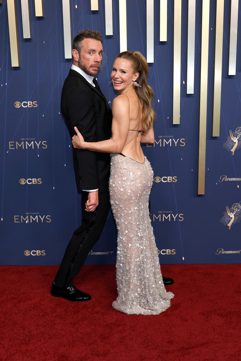 Dax Shepard and Kristen Bell attends the 77th Primetime Emmy Awards at Peacock Theater .