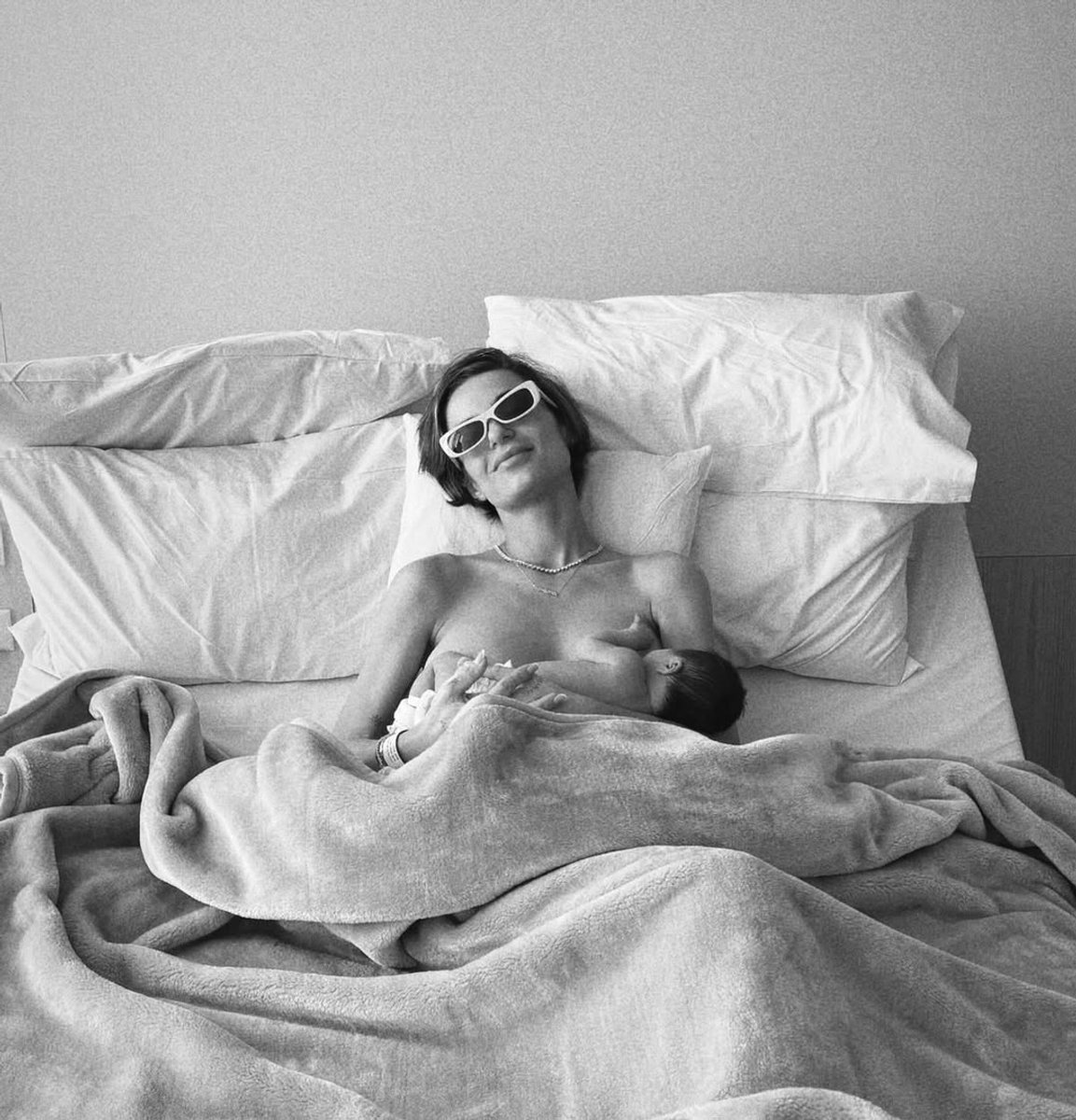 Domenica Calarco holds her newborn baby girl in bed.