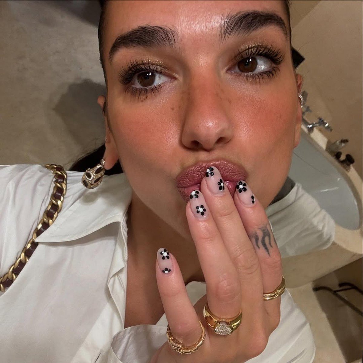 Dua Lipa shows off her engagement ring,