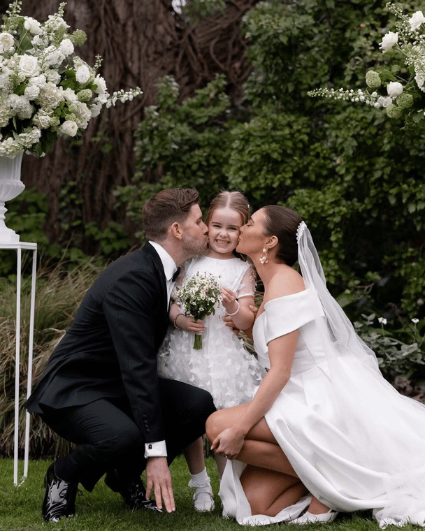 Erin had a surprise cryptic pregnancy, she didn't know she was pregnant. Here she is with her partner Dan and daughter Isla on their wedding day.