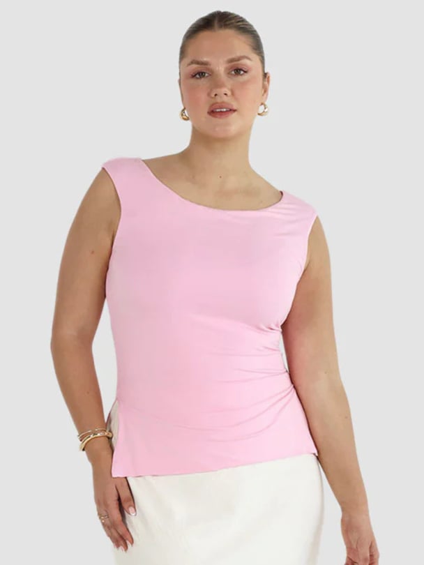 Model in pink A-line singlet.