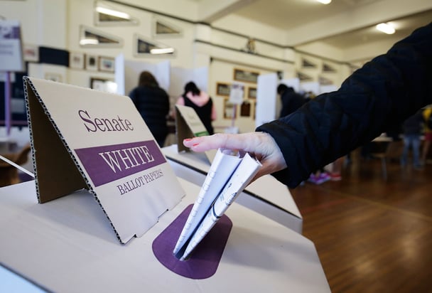 A woman's hand casts a ballot for the Senate in the Australian federal election.
