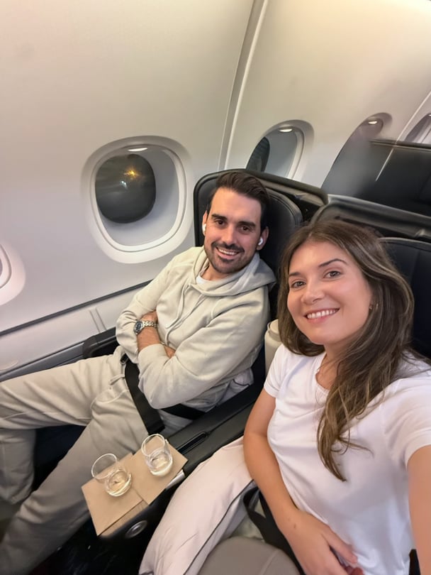 Paige and her partner in-flight going to Bali.