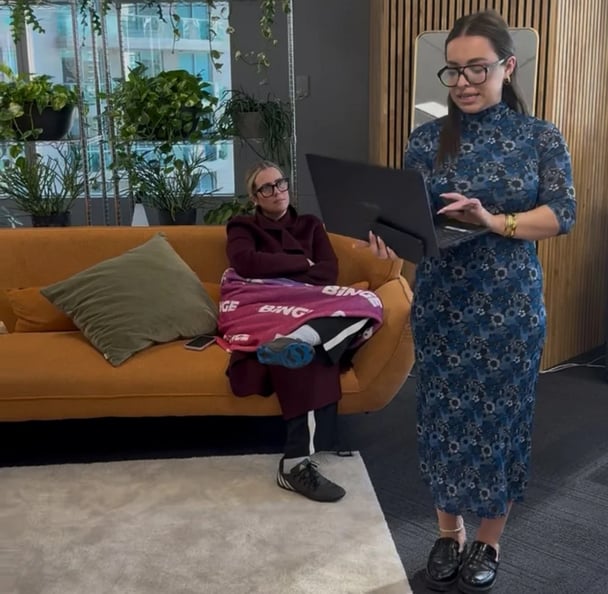 woman wearing football boots to a meeting.