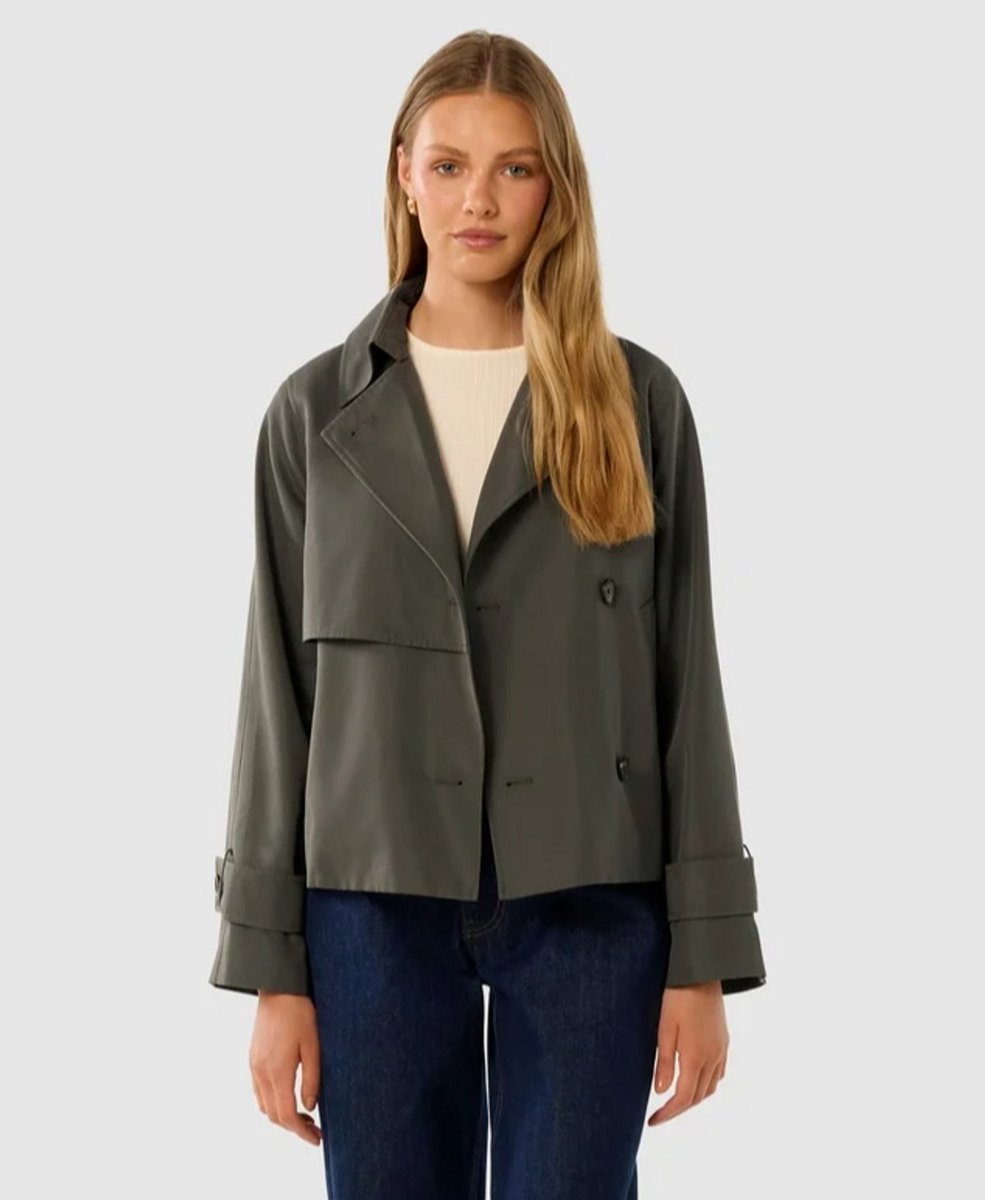 woman wearing cropped trench coat 