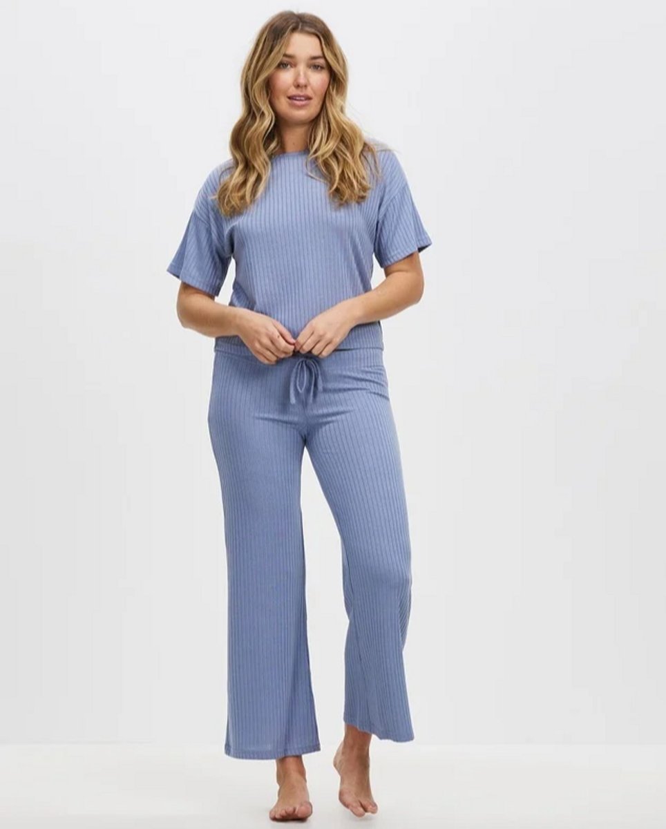 woman wearing pale blue ribbed pj set