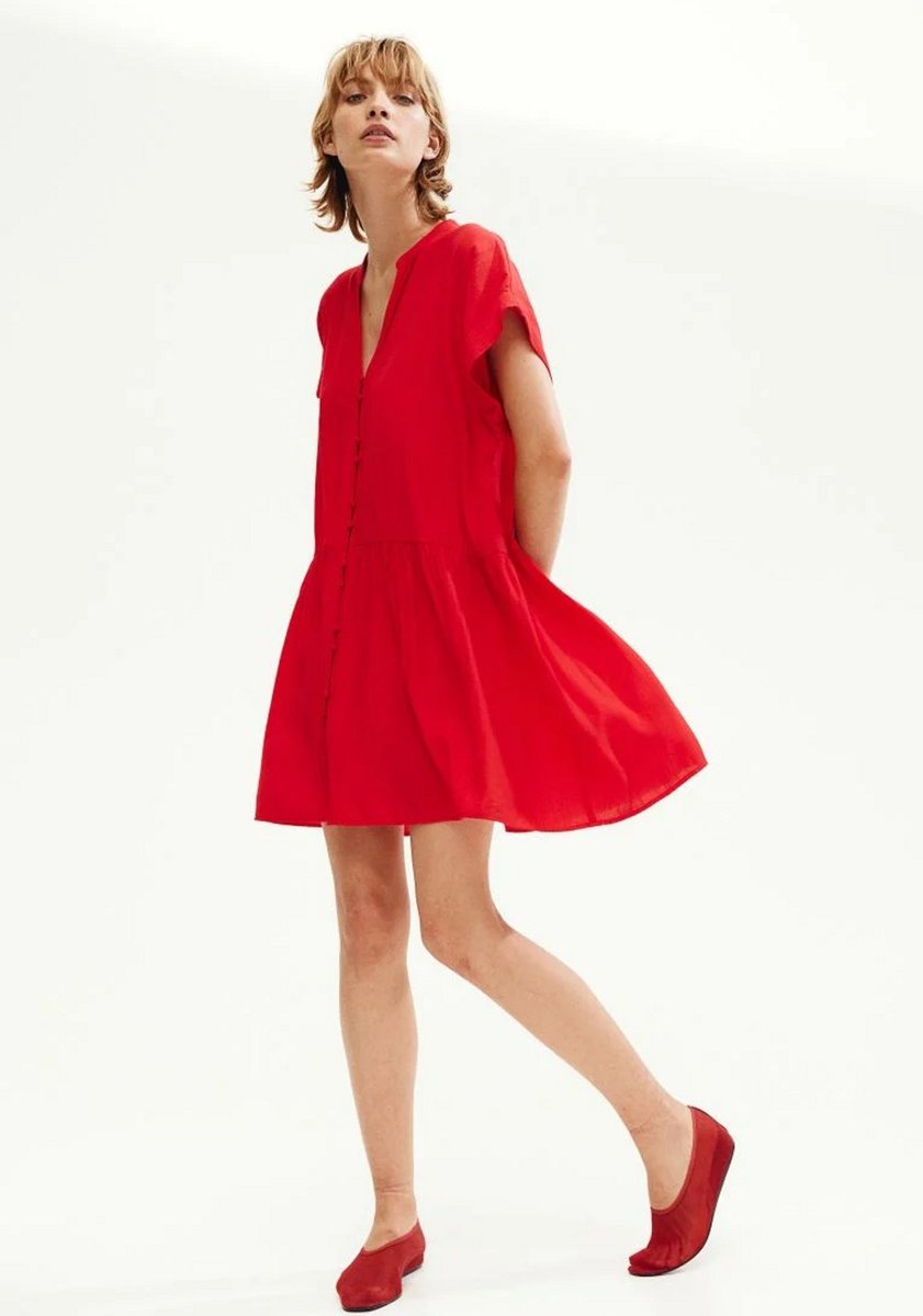 woman wearing red crickle dress