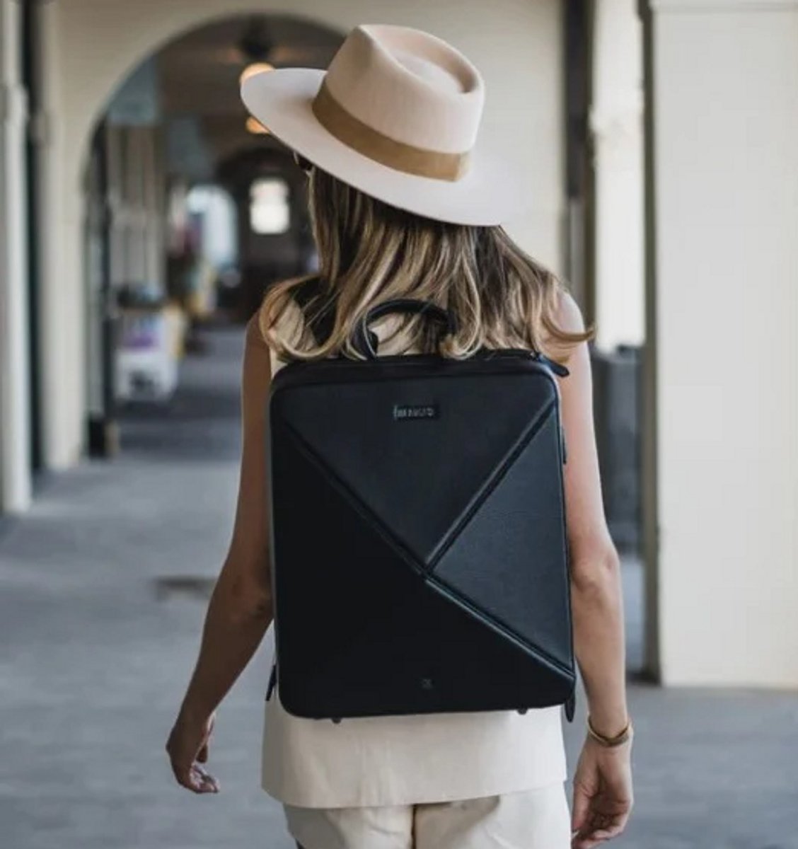 woman carrying black backpack 