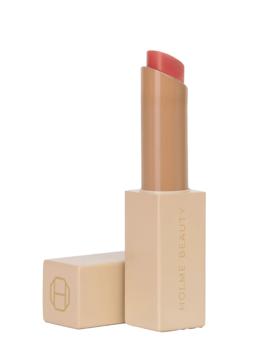 Holme Beauty Stay Glaze lipstick in coral shade.