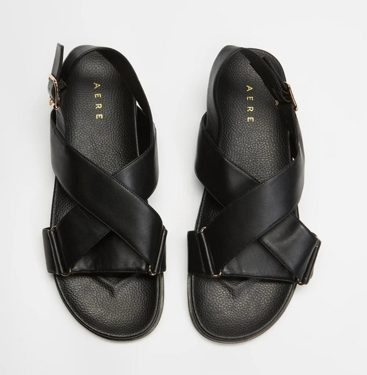 The Iconic Crossover Leather Footbed by Aere in black.