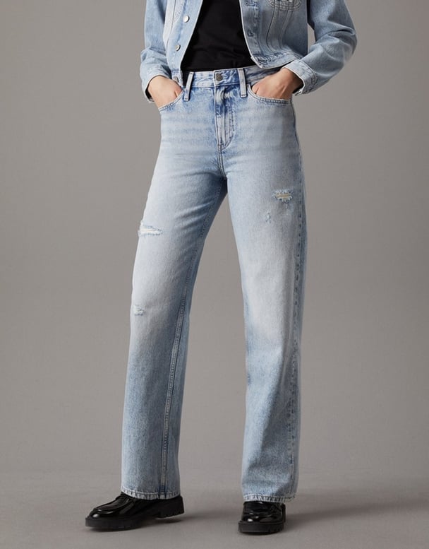 woman wearing calvin klein distressed jeans 