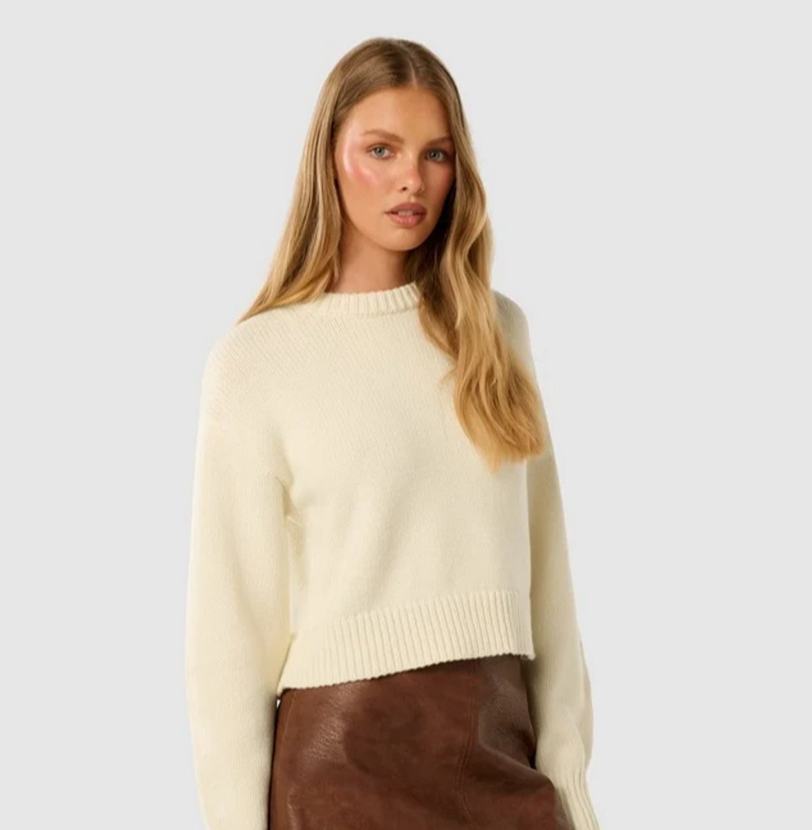 woman wearing light yellow knit jumper from Forever New