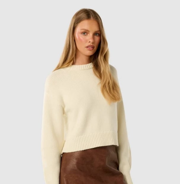 woman wearing light yellow knit jumper from Forever New