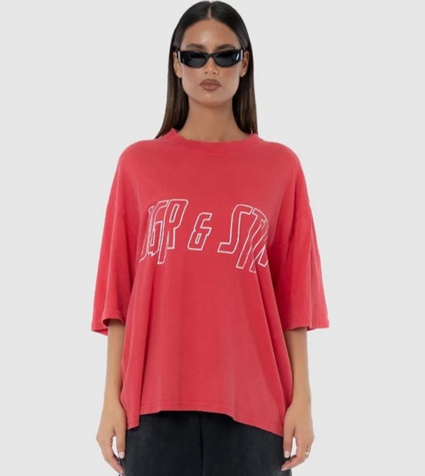 woman wearing red oversized tee from Jagger and Stone with sunglasses 