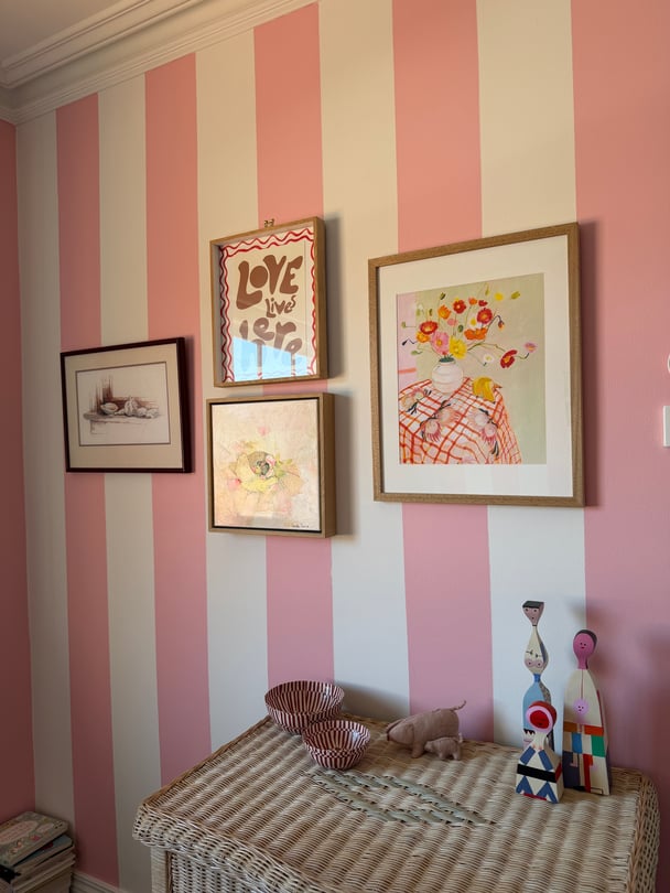 white and pink striped nursery