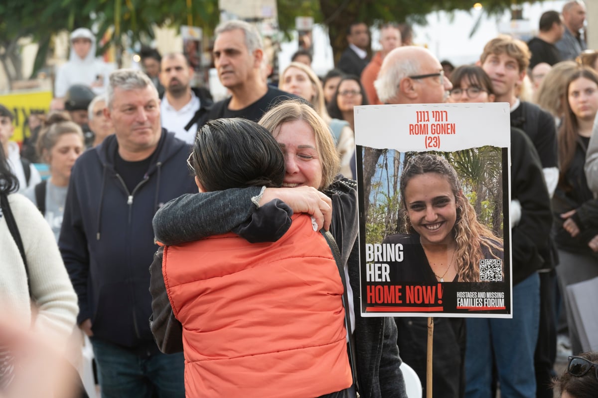 People gather in Tel-Aviv to watch a livestream of the release of Israeli hostages Emily Damari, Romi Gonen, and Doron Steinbrecher. 