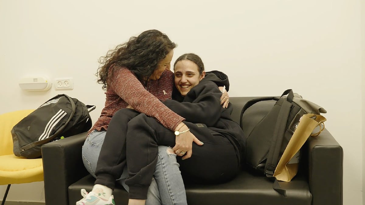 Romi Gonen (R) embracing her mother Merav after being released as a hostage from Gaza.