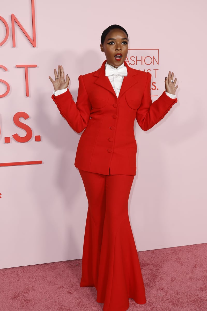 Janelle Monáe at the Fashion Trust event in a red tailored suit. 