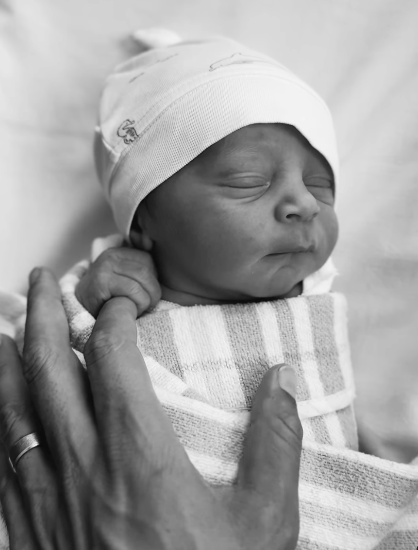 A black and white photo of the Bachelor Australia's Jimmy Nicholson and Holly Kingston's newborn son Lennox James Nicholson.