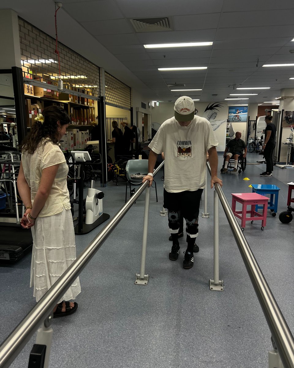 Johnny learning to walk again in hospital.