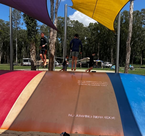 kids jumping on a jumping pillow