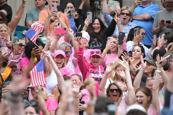 Supporters cheer as the verdicts are read in the Karen Read murder trial.