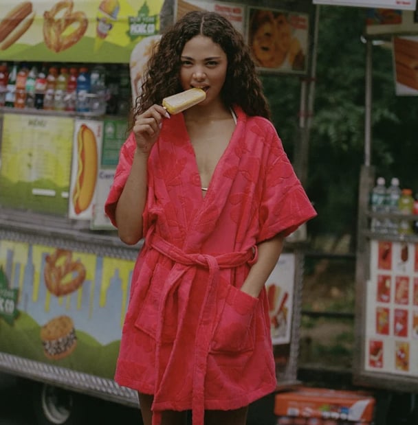woman wearing watermelon coloured robe