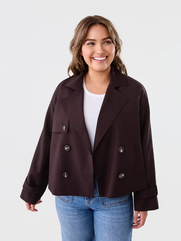 Model in cropped brown trench.