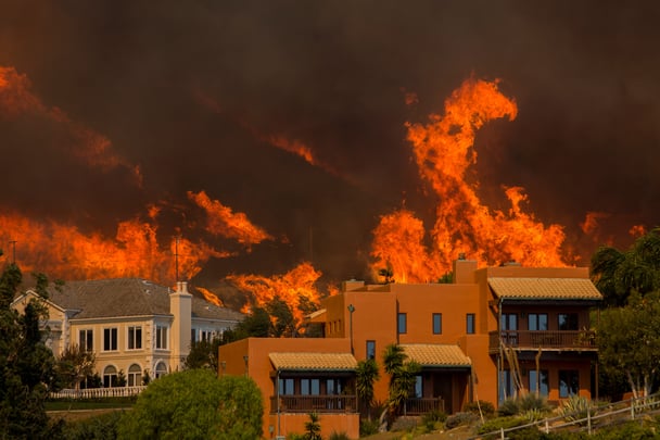 Wildfires rage behind homes in LA.